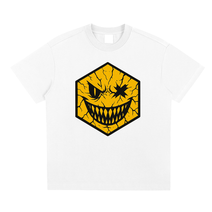 Hexagonk broken face graphic tee showing a cracked yellow hexagon character with jagged teeth and sinister eyes